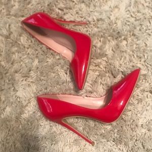Red stiletto pointed toe pumps